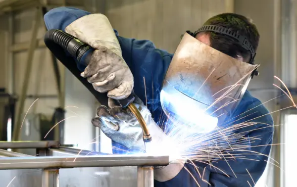 Welder using their first welding machine.