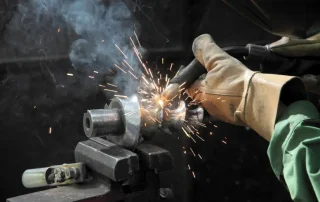 Welding machine up close with sparks flying