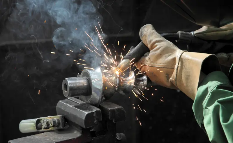 Welding machine up close with sparks flying